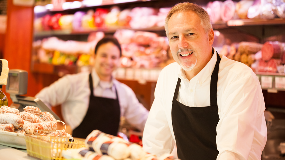 store owners smiling for camera