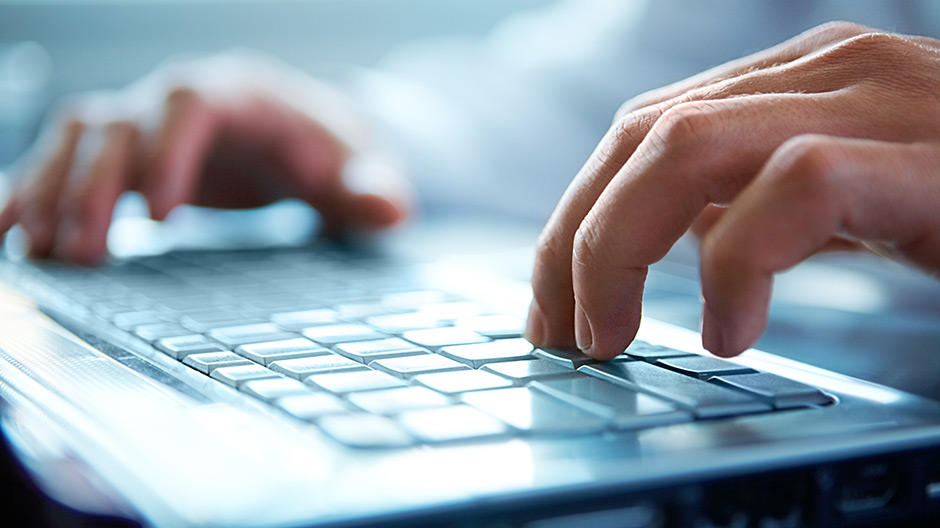 Hands typing on Keyboard