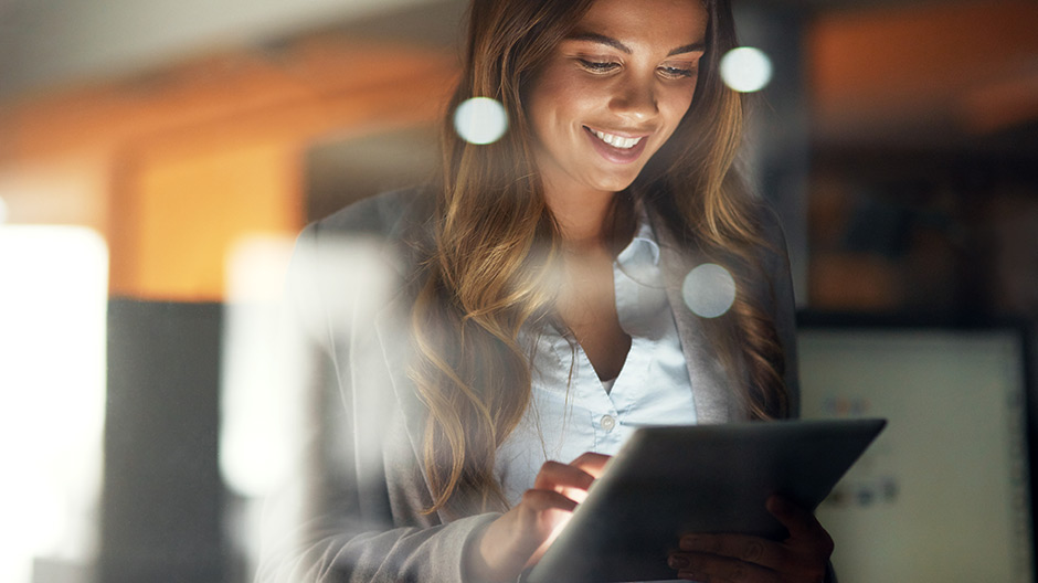 Businesswoman using digital tablet at office