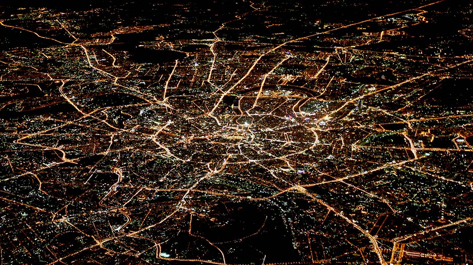 A general view of night Moscow is seen from the window of a passenger jet, October 8, 2010.